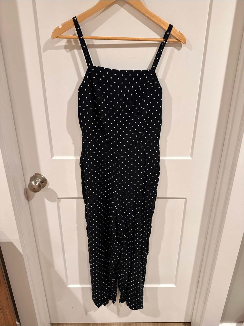 Black Polka Dot Spaghetti Strap Jumpsuit w/ pockets. Wide, cropped leg